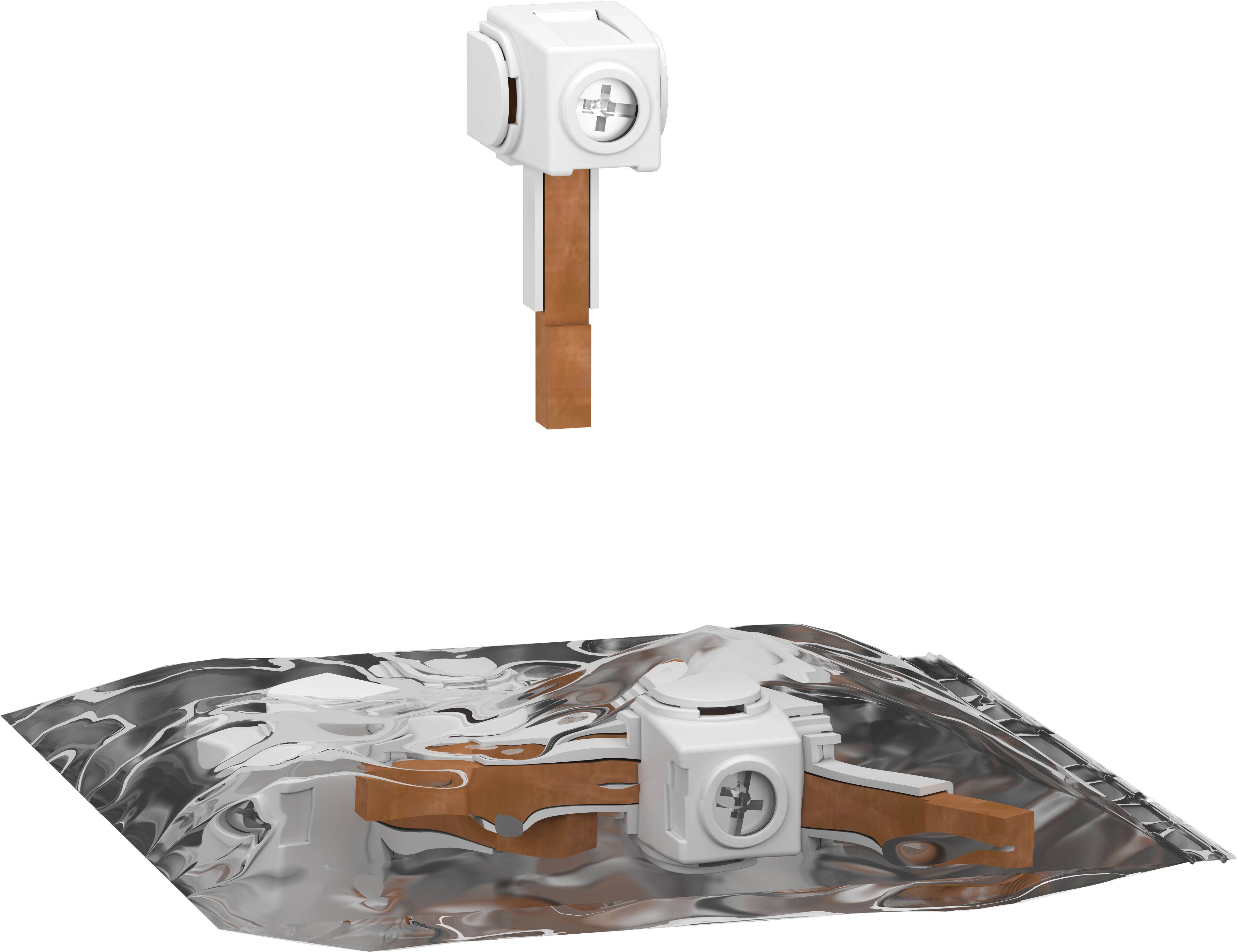 Ein medizinischer Sensor mit weißen Kunststoffteilen und braunen Elektroden liegt auf einer silbernen Verpackung.