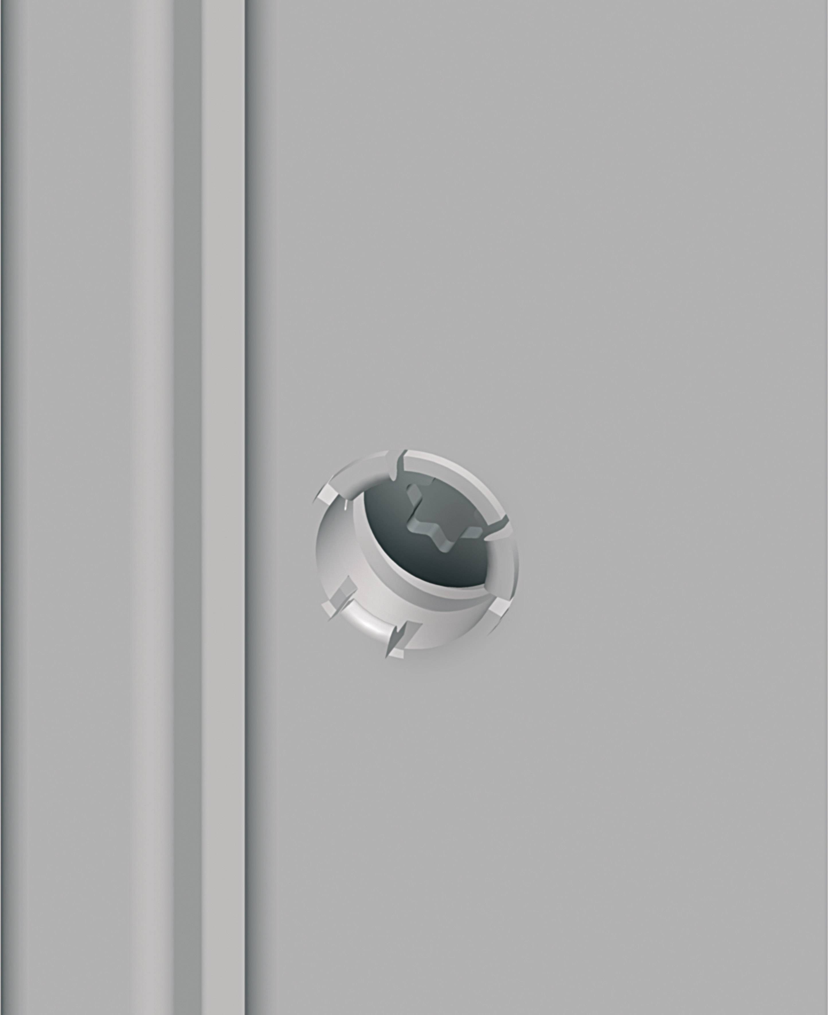 Nahaufnahme eines runden Metallknaufs an einer grauen Wand oder einem Gerät, möglicherweise Teil eines Tür- oder Schrankmechanismus.
