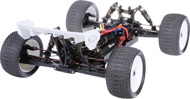 Ferngesteuertes Auto, Chassis ohne Karosserie, zeigt Antriebsstrang und Federung. Breite Reifen, Spoiler hinten montiert.