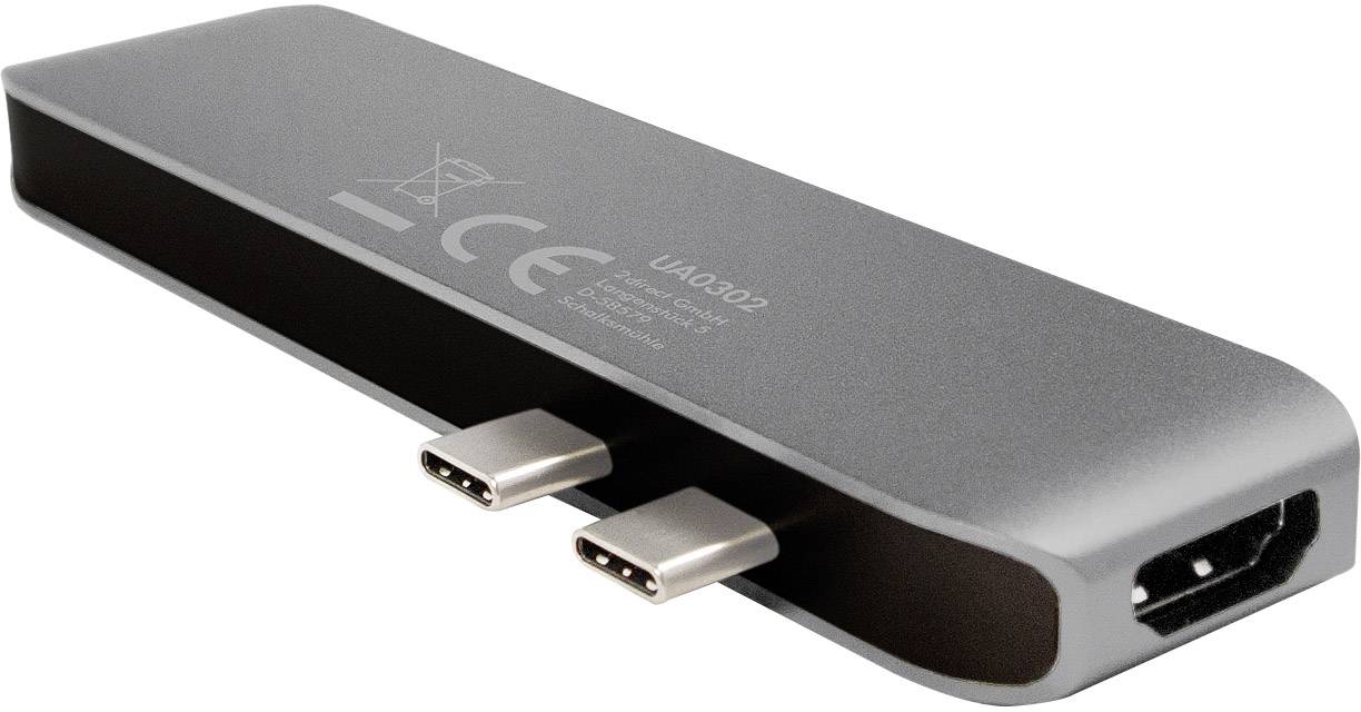 Ein silberfarbener USB-C-Hub mit zwei USB-C-Anschlüssen und einem HDMI-Anschluss. Ziel: Erweiterung der Anschlussmöglichkeiten für Geräte.