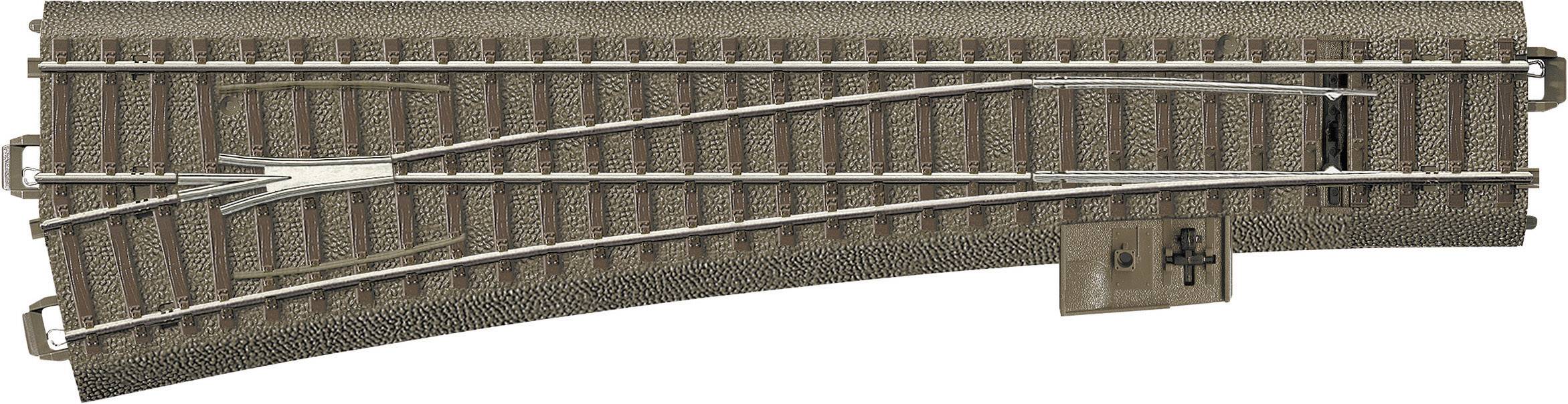 Eisenbahnweiche mit zwei Gleisrichtungen auf einer Modellbahnanlage.