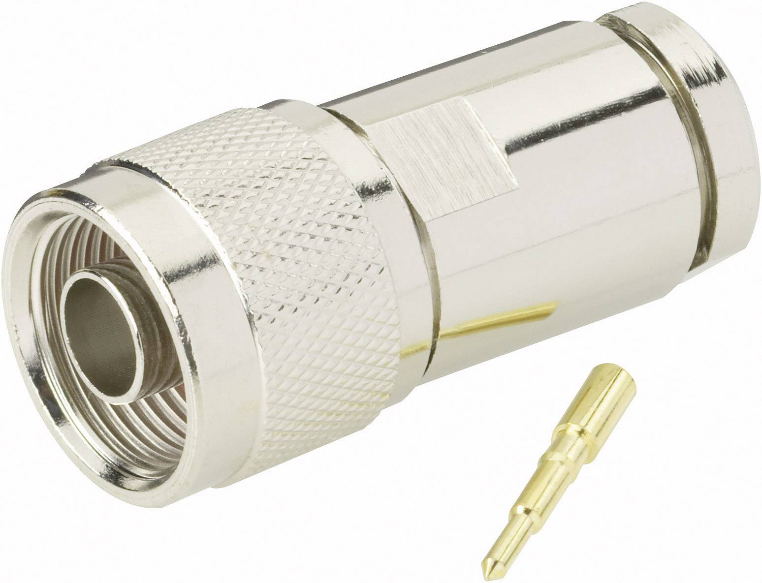 Ein metallischer Koaxialstecker mit geriffeltem Griff und einem goldfarbenen Stift liegt auf einer weißen Fläche.