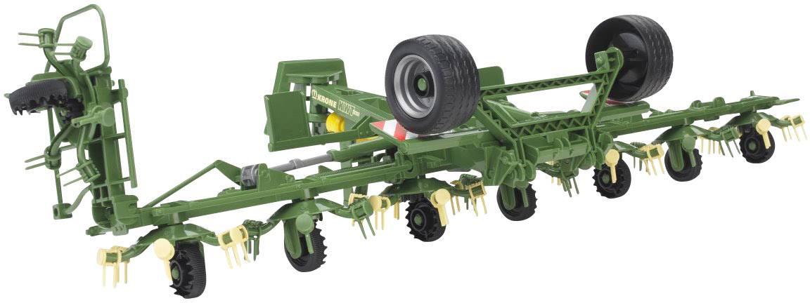 Grüne landwirtschaftliche Maschine mit Rädern und Haken, vermutlich ein Pflug oder Grubber für landwirtschaftliche Arbeiten.