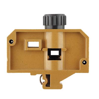 Ein rechteckiges, braunes Gerät mit einer schwarzen Einstellschraube oben; möglicherweise ein handwerkliches oder technisches Werkzeug.