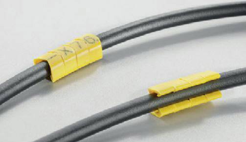 Zwei schwarze Kabel mit gelben, beschrifteten Markierungen zur Identifizierung; obere Markierung zeigt '-X76'.