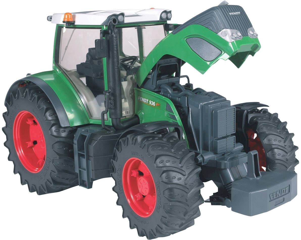 Ein grüner Spielzeugtraktor mit roten Reifen und einem offenen Motorhaube zeigt seinen Motor. Der Traktor ist detailliert gestaltet.