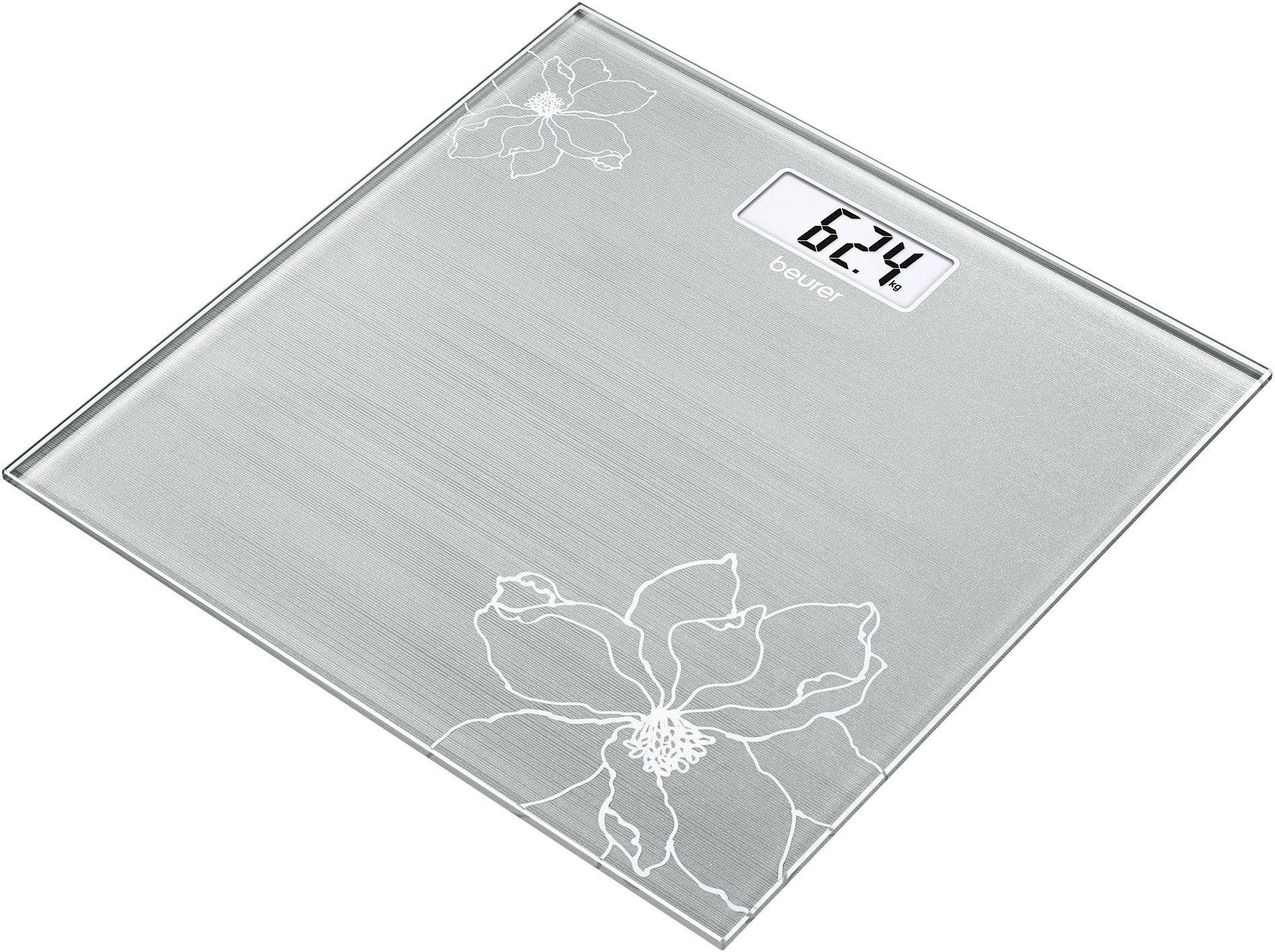 Digitale Personenwaage mit Blumenmuster und Anzeige von '62.4'.