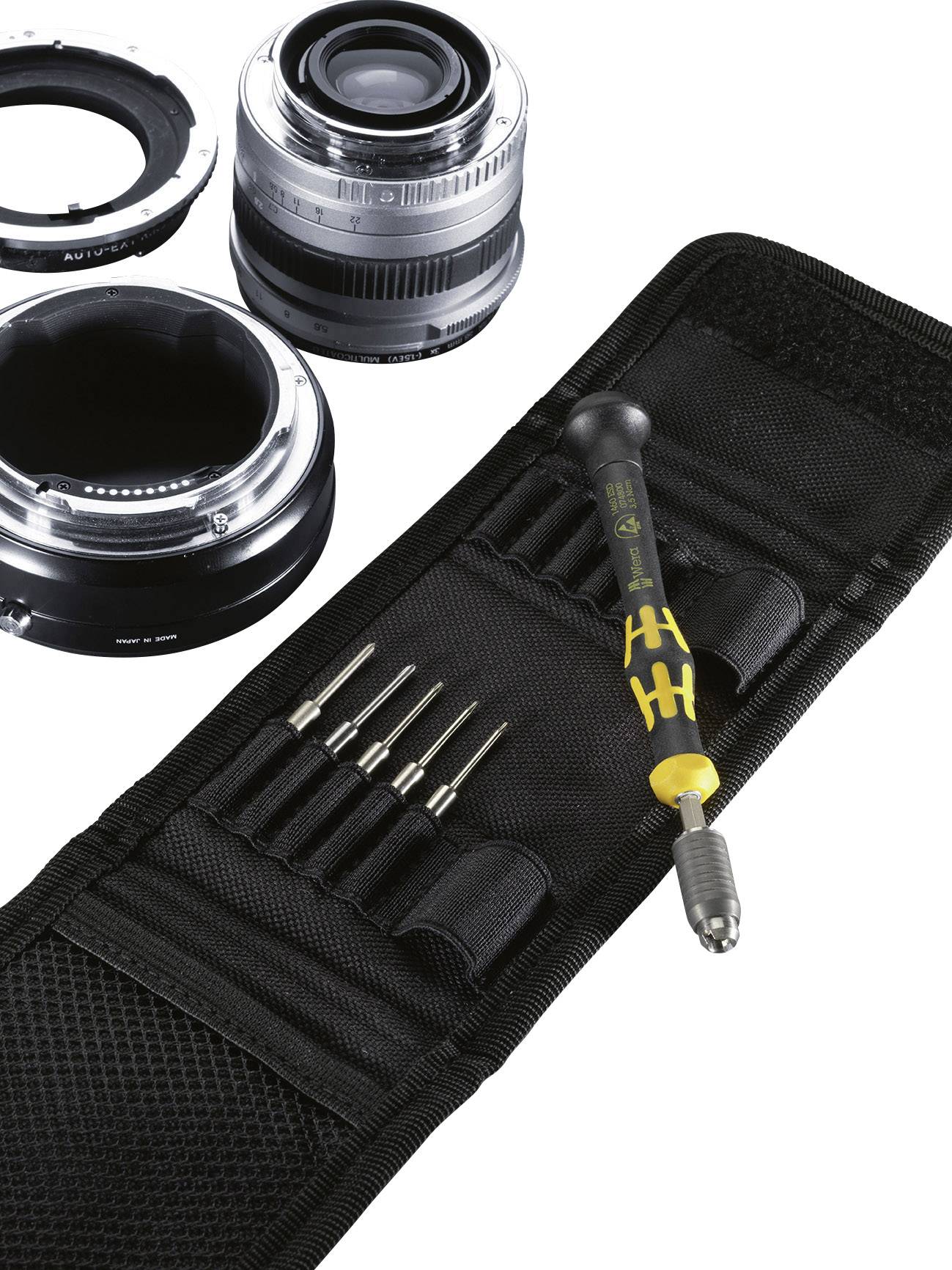 Kameralinsen und ein schwarzes Etui mit Präzisionsschraubendrehern, die für die Reparatur oder Wartung von Fotokameras verwendet werden.