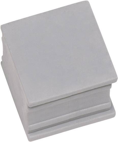 Ein grauer, quadratischer Betonblock mit glatter Oberfläche und gestuftem Sockel, verwendet als Bauelement oder Dekoration.