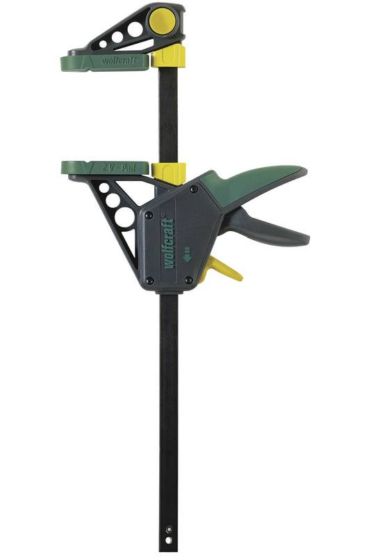 Eine Einhandzwinge in Schwarz und Grün, mit einem ergonomischen Griff und gelben Akzenten. Verwendet zum sicheren Fixieren von Werkstücken.