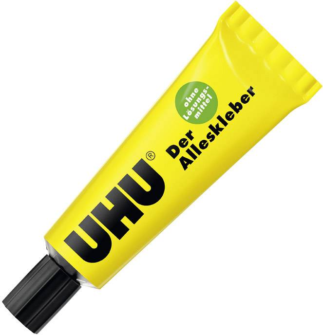 Eine gelbe Tube UHU 'Der Alleskleber' liegt diagonal. Text auf Tube: 'ohne Lösungsmittel', schwarzer Verschluss.