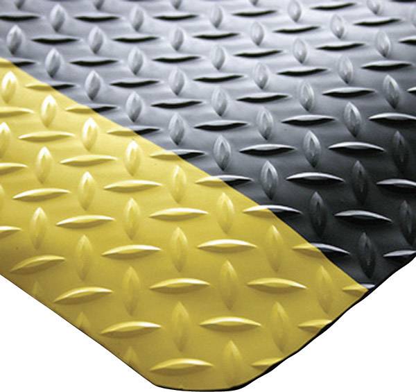 Rutschfeste Gummimatte mit schwarz-gelbem Schachbrettmuster, geeignet für industrielle Sicherheitsanwendungen, zeigt erhöhte Diamantplattenstruktur.
