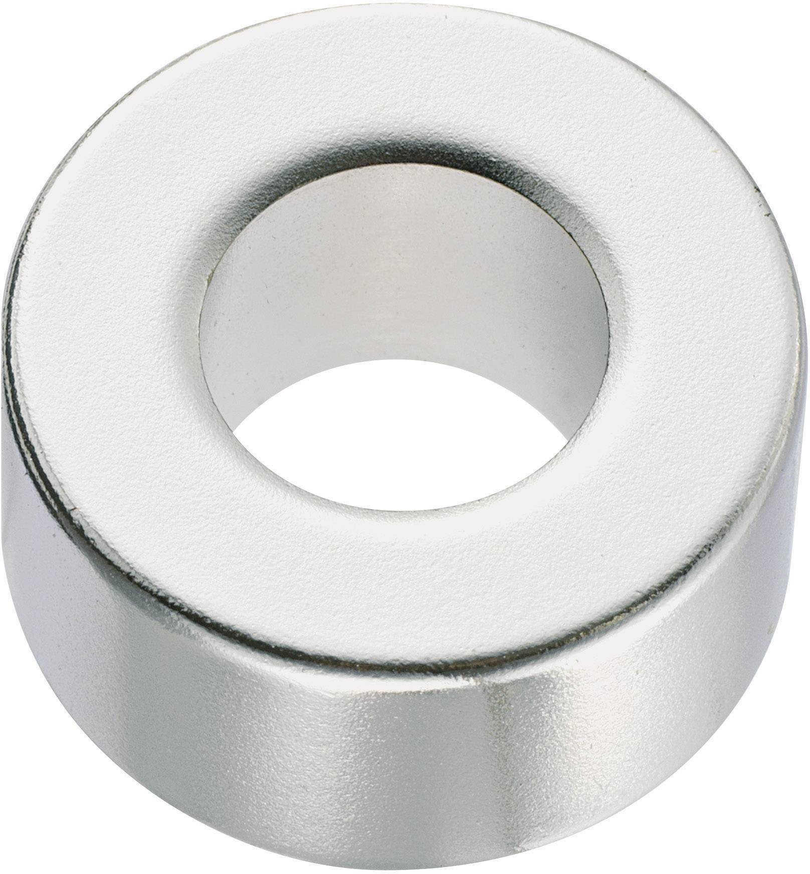 Ein silberner Ringmagnet mit einem großen zentralen Loch, liegt flach auf der Oberfläche. Der Magnet hat eine glänzende Oberfläche.