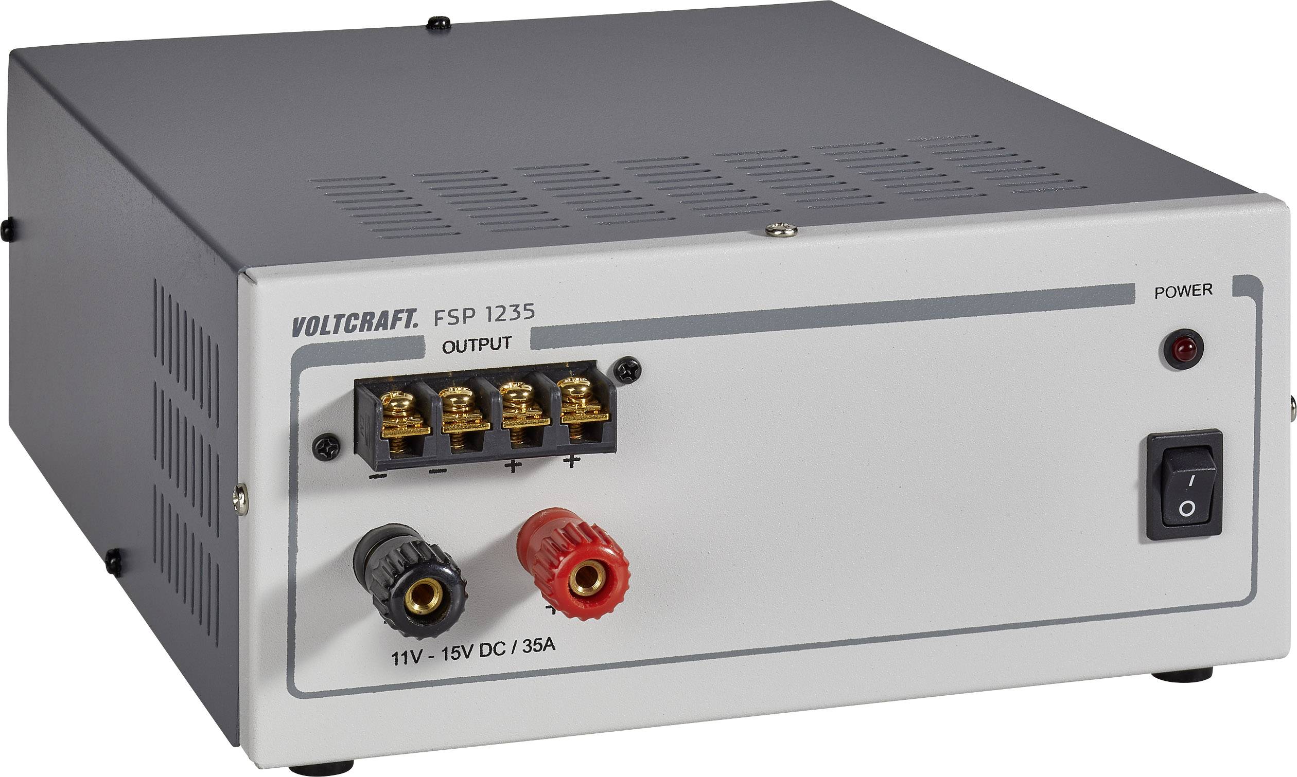 Graues Netzgerät mit Voltcraft-Logo. Es zeigt Anschlüsse für 11V-15V DC, 35A und einen Netzschalter. Geeignet für elektrische Geräte.