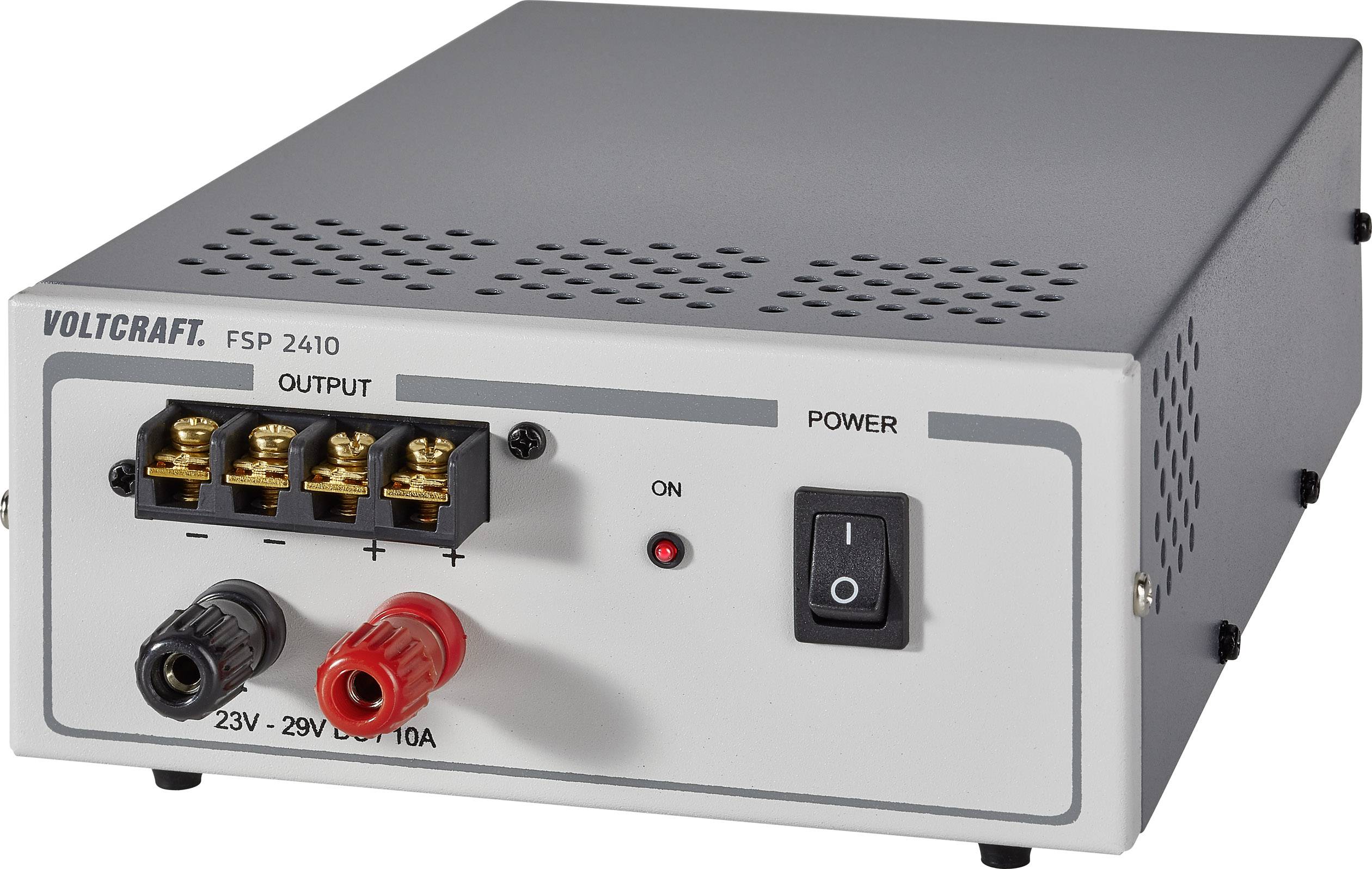 Eine graue Gleichstromquelle mit der Aufschrift 'VOLTCRAFT FSP 2410'. Sie hat Anschlüsse für Stromausgabe und einen Ein/Aus-Schalter.