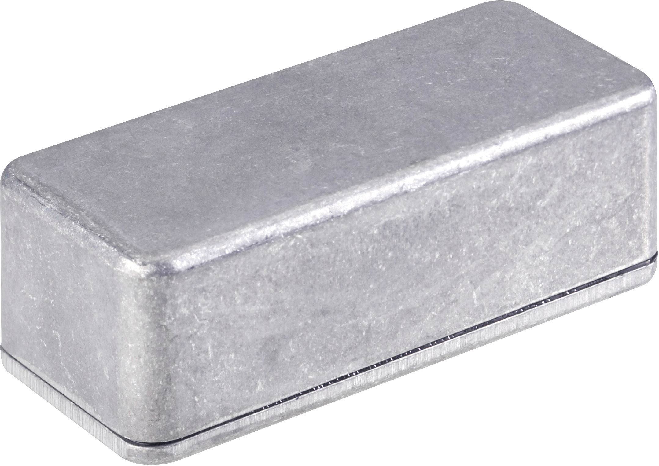 Rechteckiger, silberner Metallblock in schlichtem Design, möglicherweise als Gehäuse oder Schutz für elektronische Bauteile verwendet.