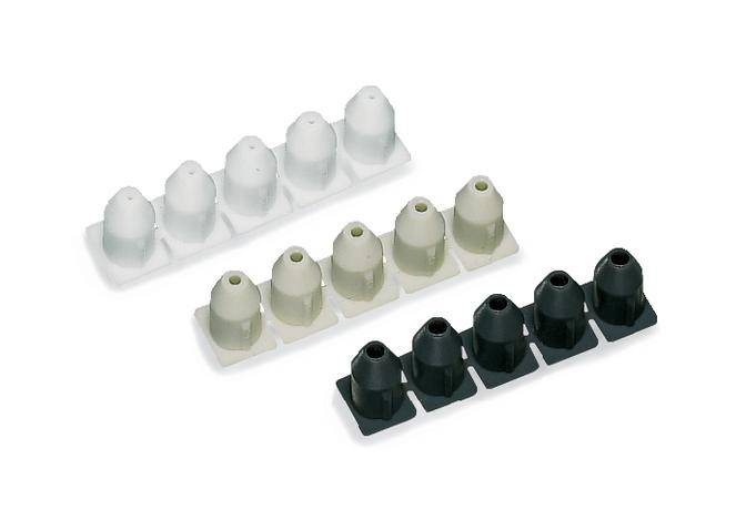 Weiße und schwarze kegelförmige Bolzen auf zwei Trägern.