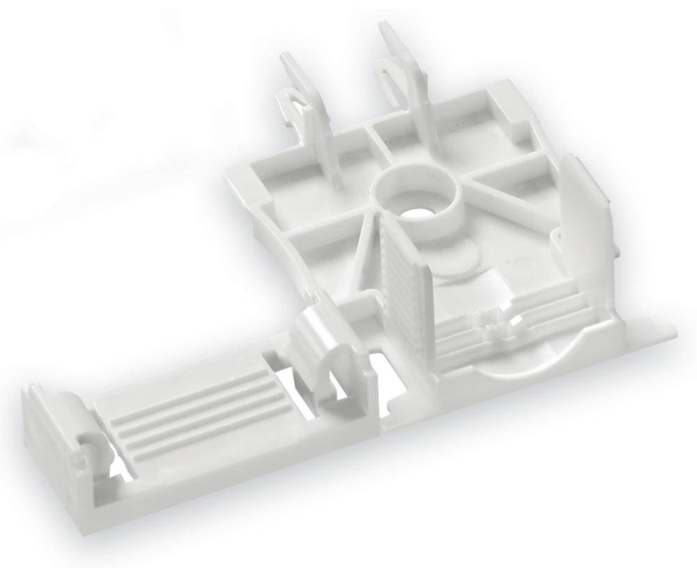 Weißes Kunststoffteil, rechteckig mit zentralem Loch und strukturierten Erhebungen, vermutlich ein technisches Bauteil oder Halterung.
