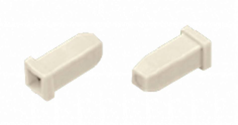 Zwei helle, rechteckige Steine mit abgerundeten Kanten, die nebeneinander liegen. Sie sind aus Plastik und sehen aus wie Bauklötze.