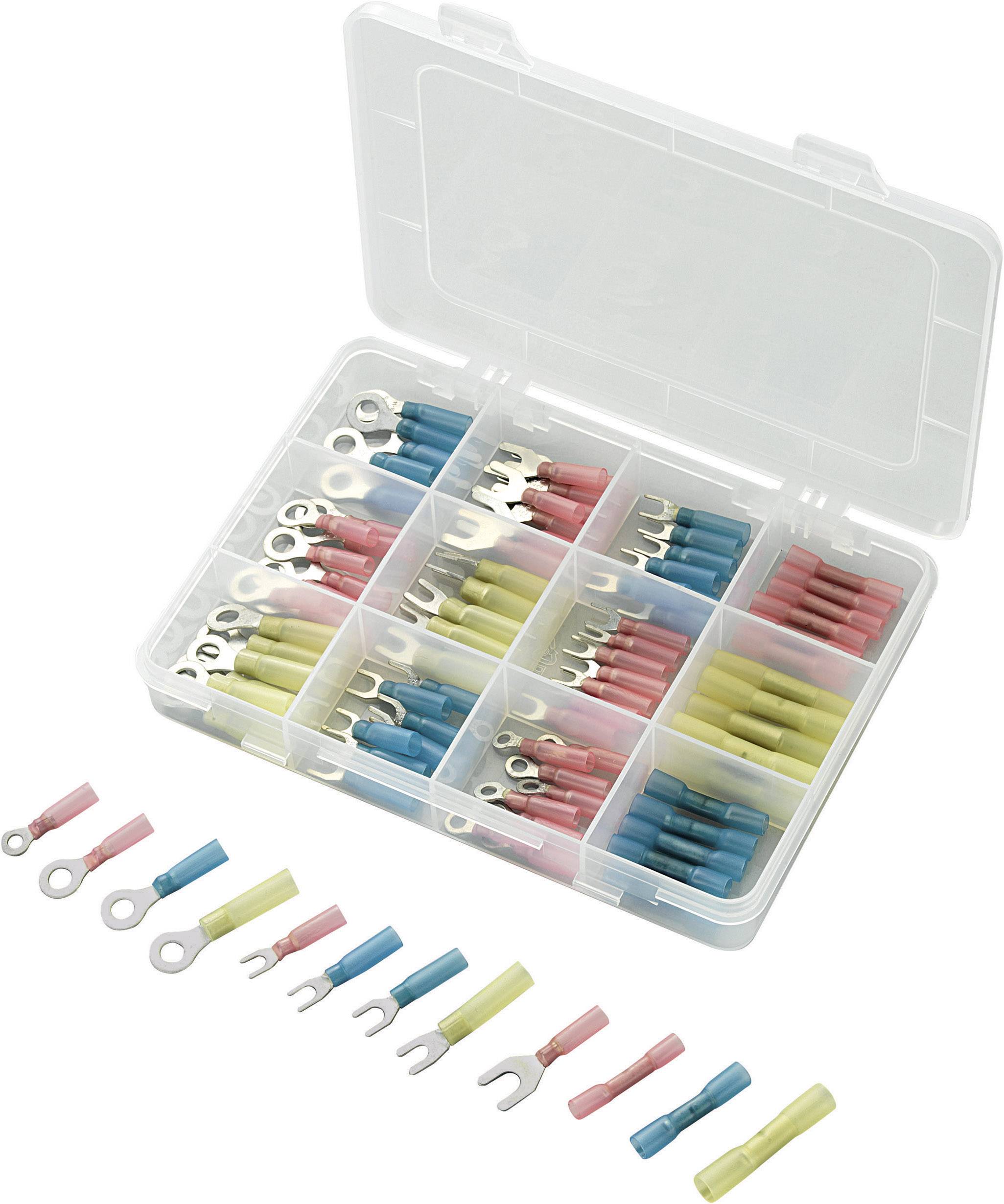 Eine geöffnete Plastikbox enthält verschiedene farbige Kabelschuhe und Verbinder, darunter blaue, gelbe und rote, geordnet in Fächer.