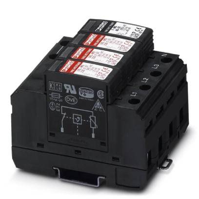 Ein schwarzer Überspannungsschutz mit drei roten Modulen, die technische Label und Symbole zeigen.
