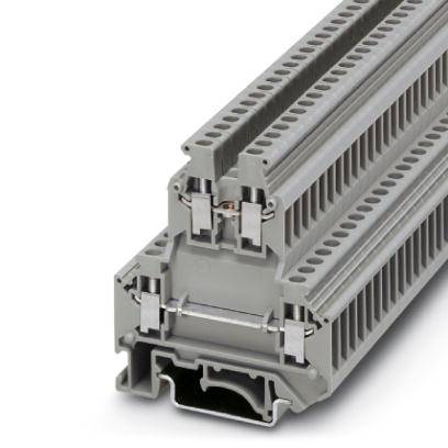 Ein grauer elektrischer Klemmenblock mit mehreren Anschlussstellen, verwendet für die Verdrahtung in Schalttafeln und elektrotechnischen Installationen.