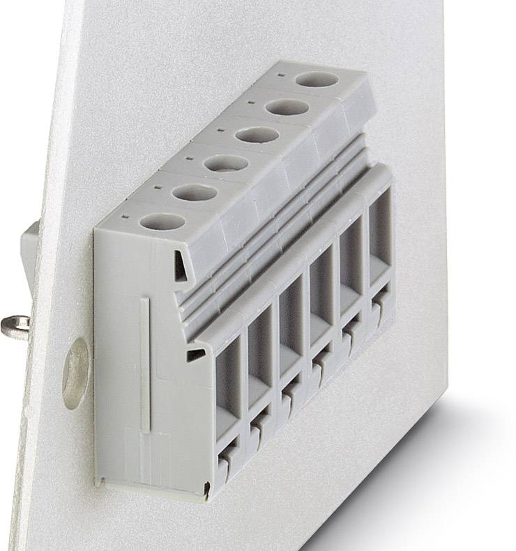 Ein grauer elektrischer Steckverbinder an einer weißen Platte. Er hat mehrere Eingänge oben und Anschlüsse unten.