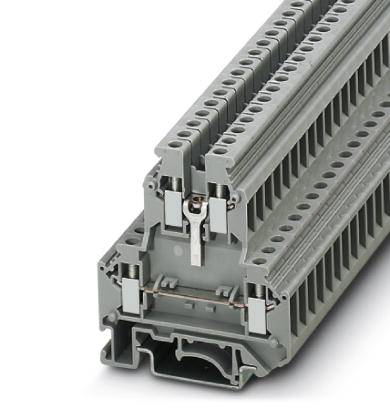 Ein grauer, mehrstufiger Reihenklemmenblock für elektrische Anlagen. Er verfügt über zahlreiche Anschlüsse für Drähte.