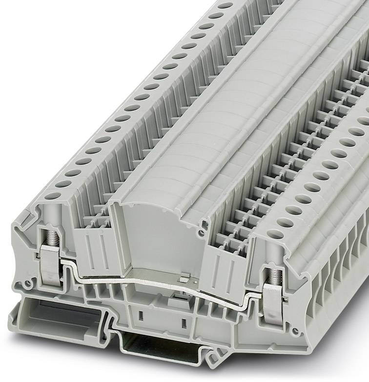 Ein grauer Klemmenblock mit mehreren Ebenen für industrielle elektrische Verbindungen.