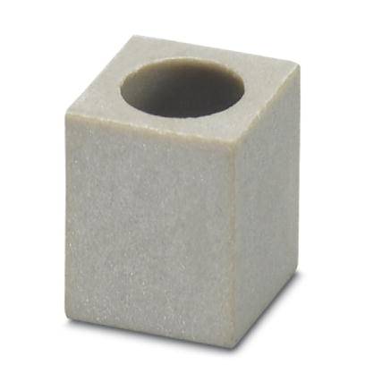 Ein grauer, kubischer Betonblock mit einem runden Loch in der Mitte.