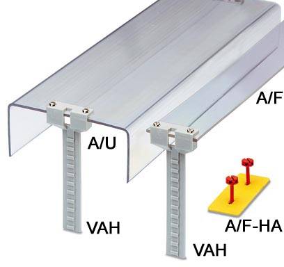 Aluminiumsystem zur Befestigung von Platten. Zeigt zwei Montageprofile beschriftet mit 'A/U VAH' und 'A/F VAH', sowie Schrauben auf gelbem Fundament.
