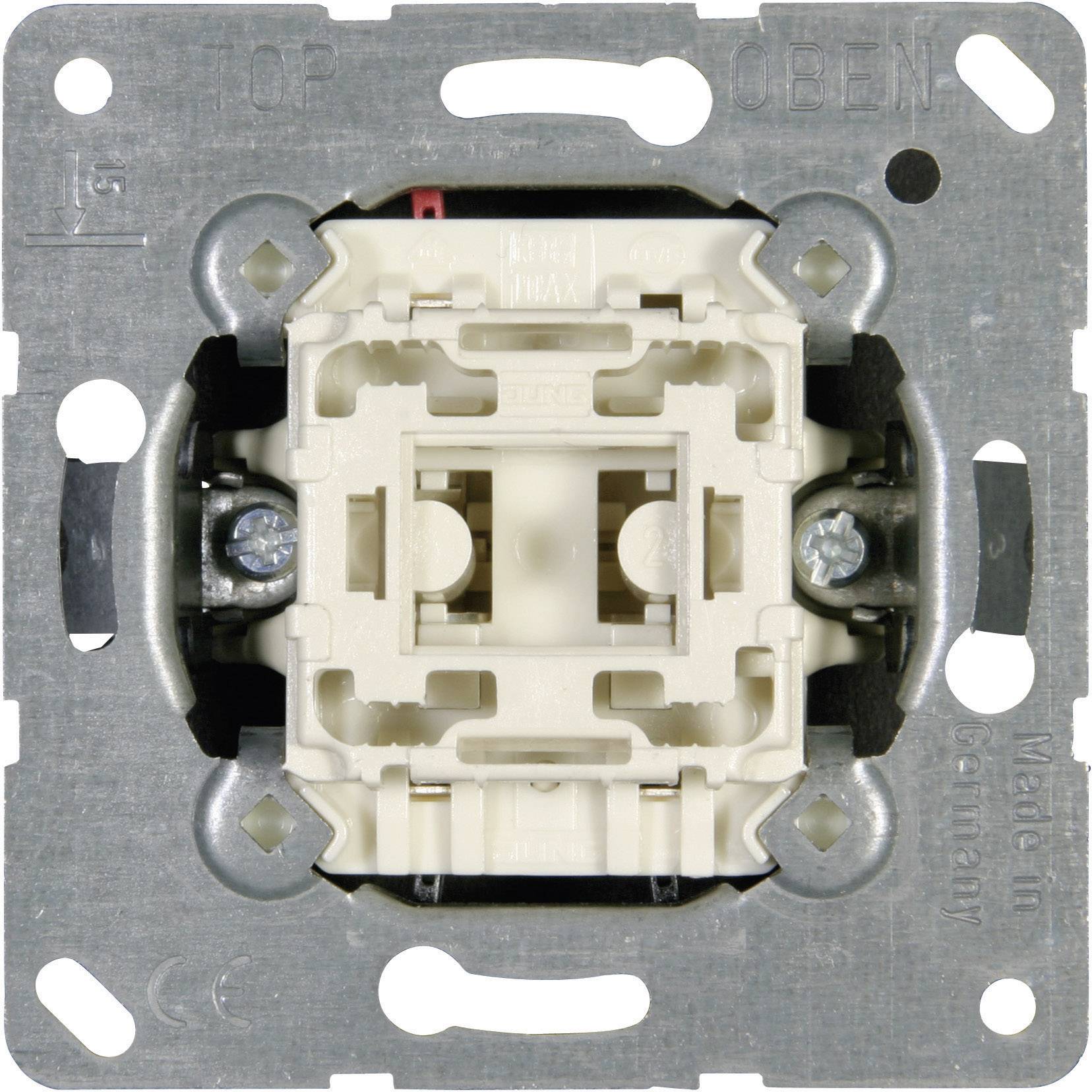 Nahaufnahme eines Lichtschalters ohne Abdeckrahmen, zeigt die interne Mechanik und die Befestigungselemente auf einer Metallplatte.