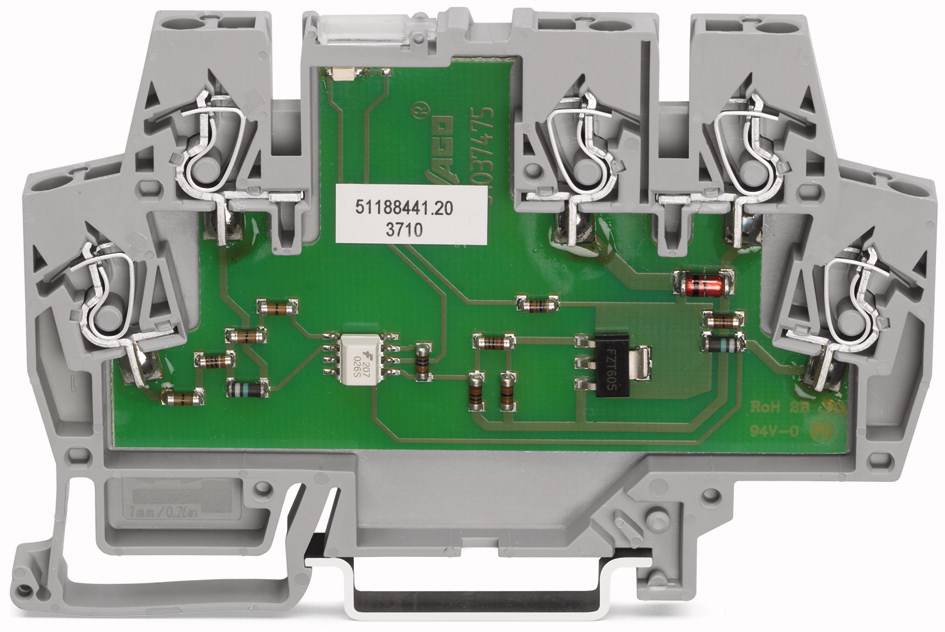 Graues Elektronikbauteil mit grüner Leiterplatte und mehreren Metallklammern, vermutlich Bestandteil eines Schaltschrankes.
