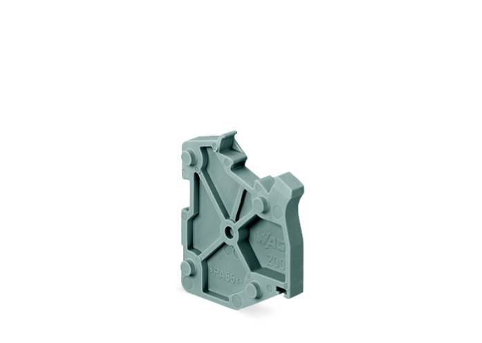 Das Bild zeigt eine graue Kunststoff-Komponente mit einer komplexen geometrischen Form, die möglicherweise Teil eines mechanischen Systems ist.