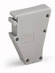Graues Kunststoff-Teil mit der Aufschrift 'WAGO 870', rechteckige Form mit abgerundeten Kanten, mehrere Schraubenlöcher.