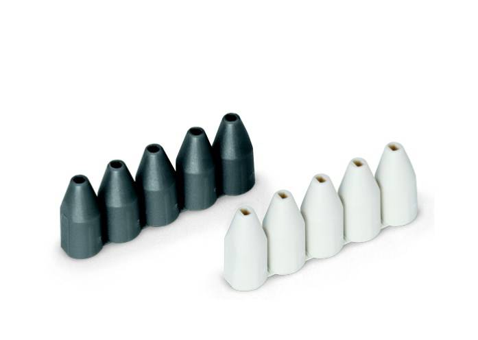 Sechs graue und sechs weiße Kegel stehen nebeneinander in zwei Reihen. Sie wirken wie kleine, konische Bausteine auf weißem Hintergrund.