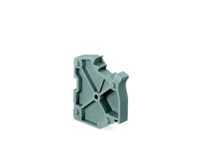 Grauer, plastischer Gegenstand mit geometrischen Formen und Erhebungen, steht aufrecht gegen einen weißen Hintergrund.
