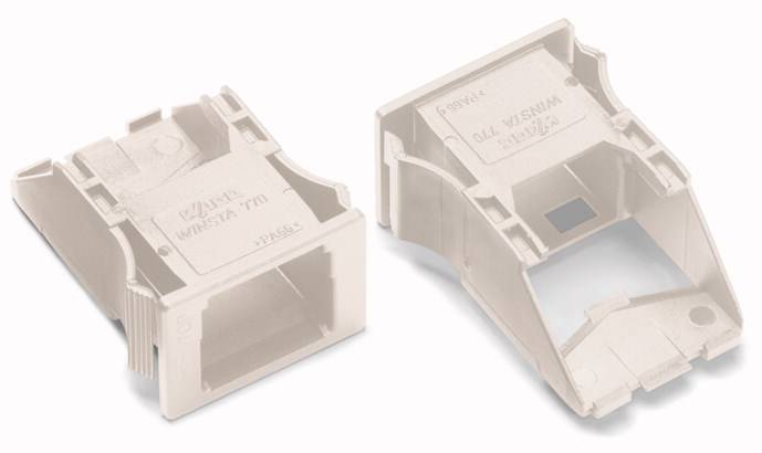 Zwei beige Kunststoff-Bauteile, vermutlich Steckverbindergehäuse, auf hellem Hintergrund. Ein Bauteil ist geöffnet, das andere geschlossen.