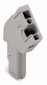 Ein grauer Kunststoffeinsatz mit mehreren rechteckigen und runden Öffnungen, möglicherweise Teil eines technischen Geräts oder Anschlusses.