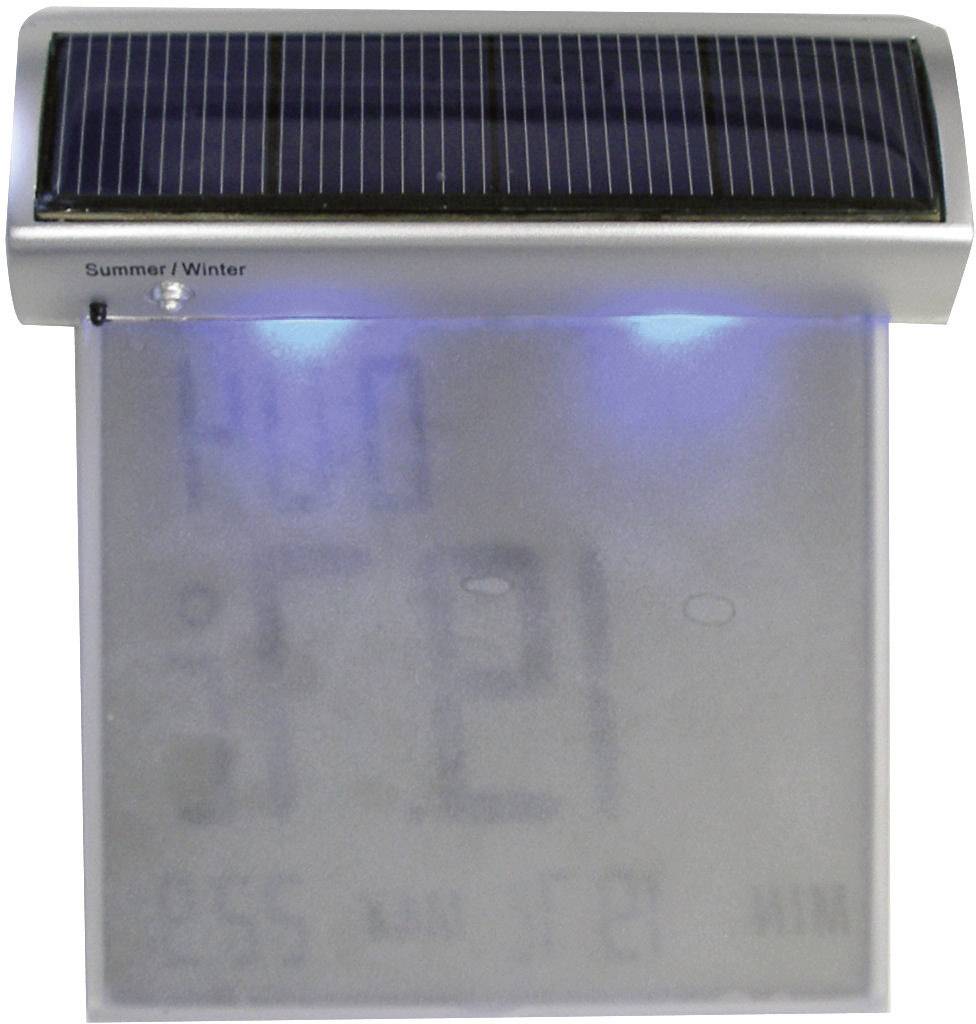 Digitales Thermometer mit Solarzelle und blauem Beleuchtungseffekt. Zeigt Temperatur und Uhrzeit an. Oben steht 'Sommer/Winter'.