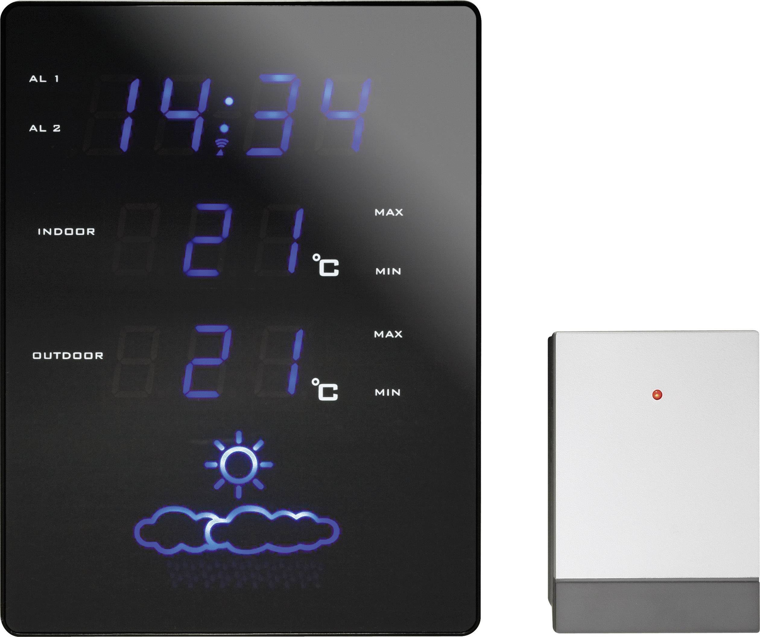 Digitale Wetterstation zeigt 14:34 Uhr, Innen- und Außentemperatur bei 21 °C, Symbol für teils sonnig. Rechts daneben ein Sensor.