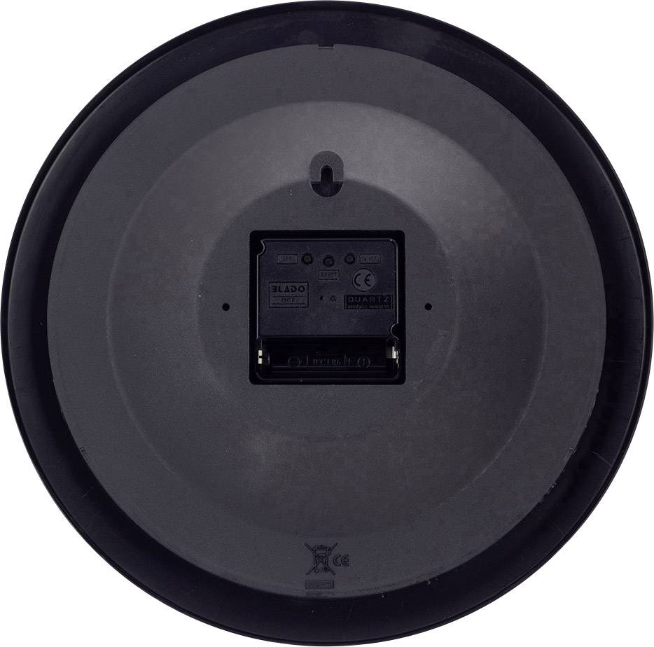 Die Rückseite einer Wand- oder Tischuhr zeigt ein batteriebetriebenes Uhrwerk mit einem Ein-/Ausschalter und Platz für eine Batterie.