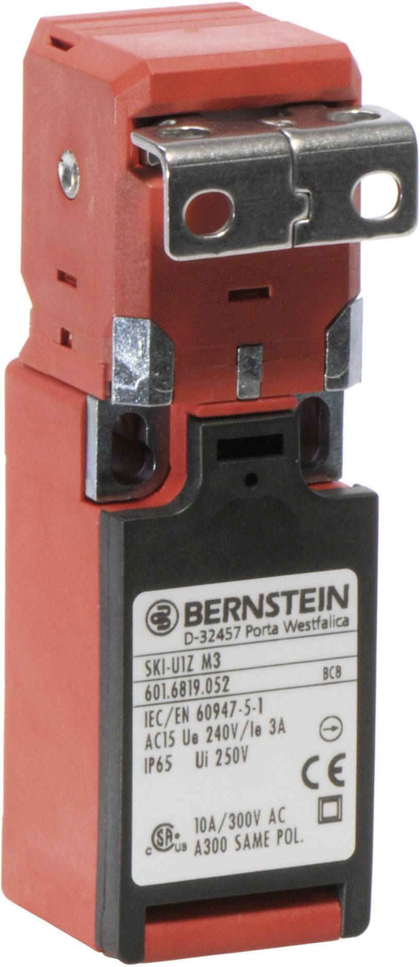 Ein roter Sicherheitsschalter mit Metallhebel und Aufschrift eines Herstellers. Zertifizierungen und technische Daten sind sichtbar.