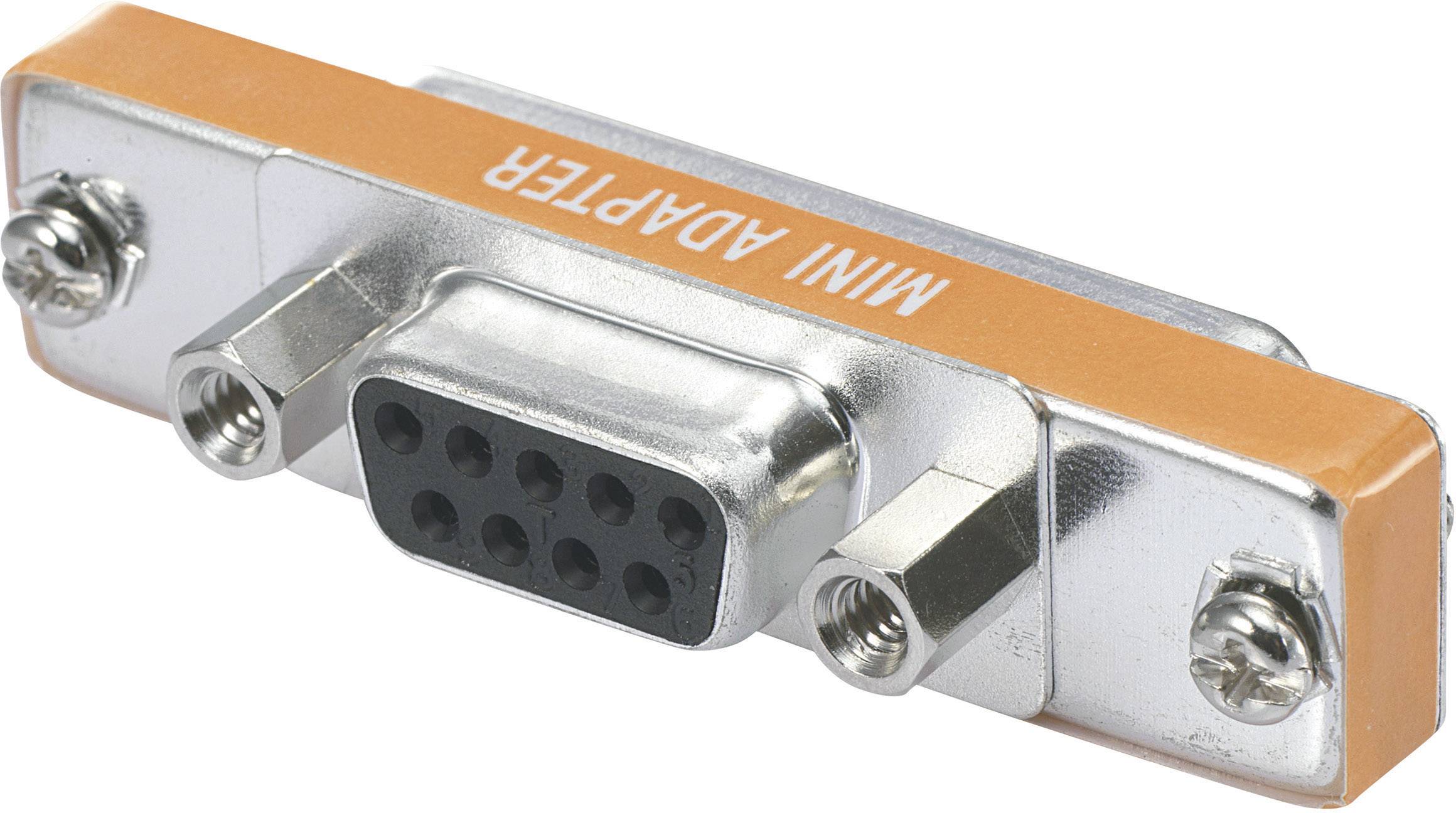 Ein silberner Mini-Adapter mit neun Pins und seitlichen Schrauben, orange markiert mit der Aufschrift 'MINI ADAPTER'.