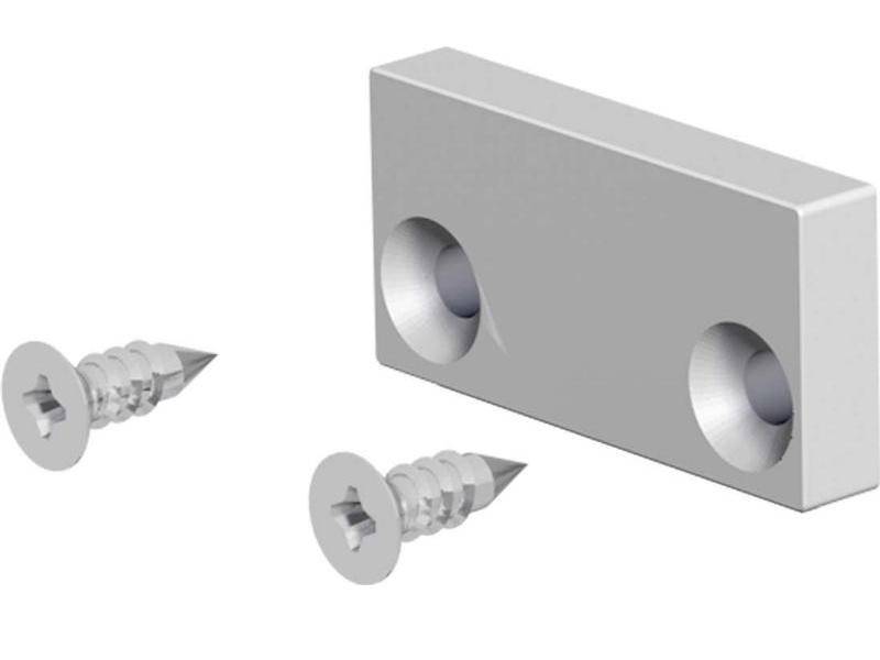 Rechteckiger Metallblock mit zwei versenkten Löchern, neben zwei silbernen Schrauben abgebildet.