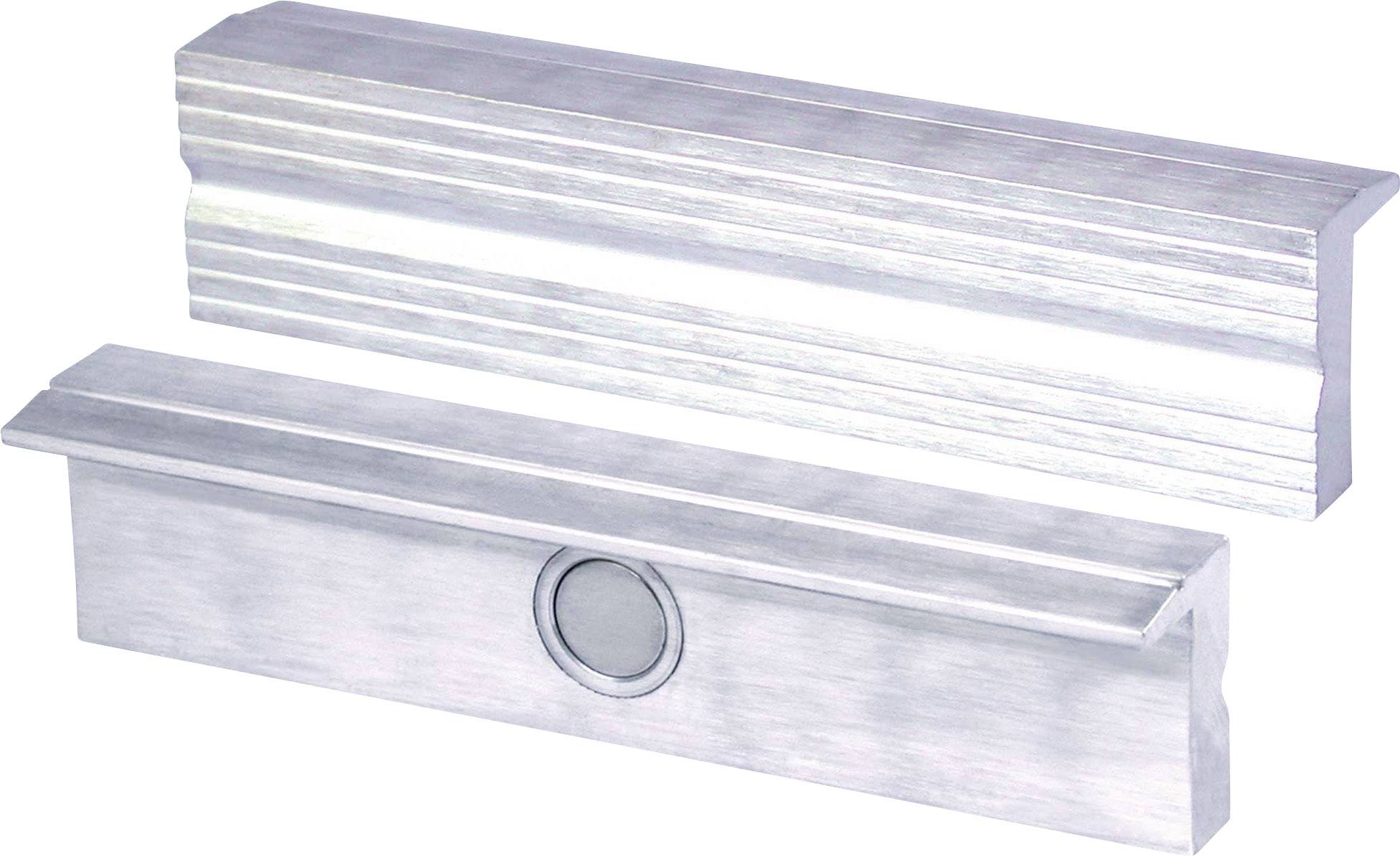 Zwei silberne Metallblöcke mit gerippten Oberflächen; einer hat ein rundes Element in der Mitte. Sie liegen nebeneinander.