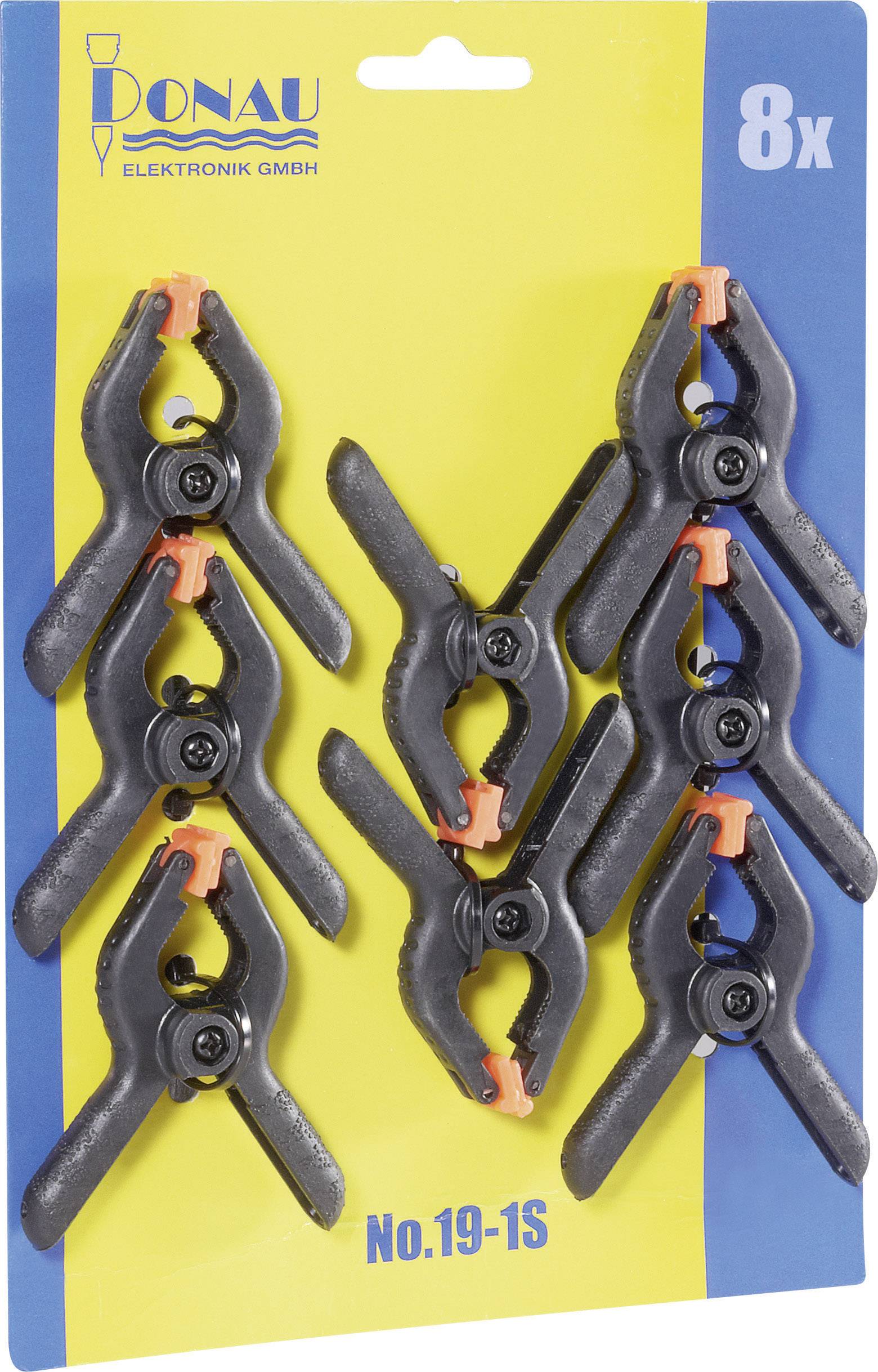 Acht schwarze Kunststoffklemmen mit orangen Spitzen, verpackt auf einer blauen Karte. Markenname und Modellnummer oben sichtbar.
