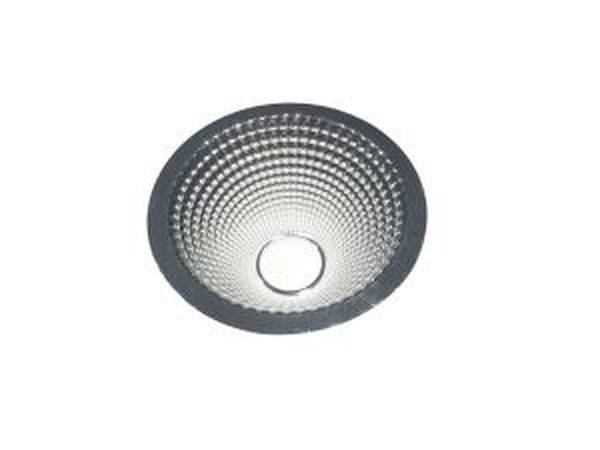 Ein runder, reflektierender Lampenreflektor, der Licht bündelt und streut.