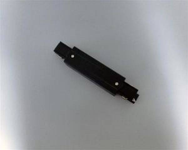 Ein rechteckiges schwarzes Objekt mit symmetrischer Form liegt horizontal vor einem grauen Hintergrund.