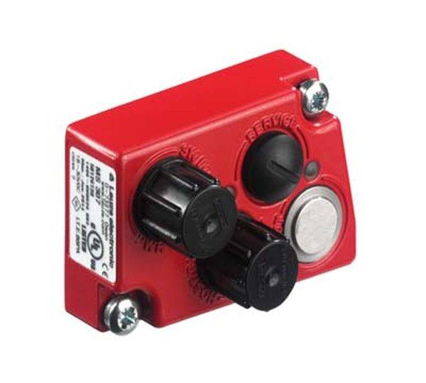 Ein rotes, rechteckiges elektrisches Gerät mit zwei schwarzen Drehknöpfen, einem schwarzen Knopf und einem Metallschalter, befestigt mit Schrauben.